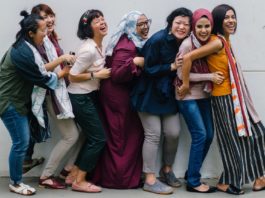 Lifestyle Photography - Group of Ethnic Women Laughing in Line